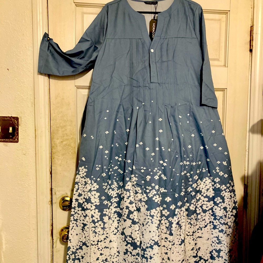 Maxi float three quarter sleeve dress.New with tags.Pale blue with cream flowers